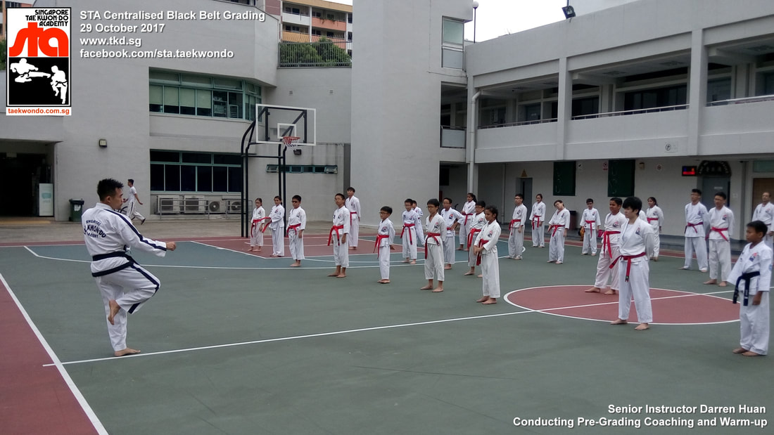Senior Instructor Darren Huan Conducting Pre-Grading Coaching and Warm-up Centralised Black Belt Grading Singapore Taekwon-do Academy HQ STA Taekwondo International 29 Oct 2017