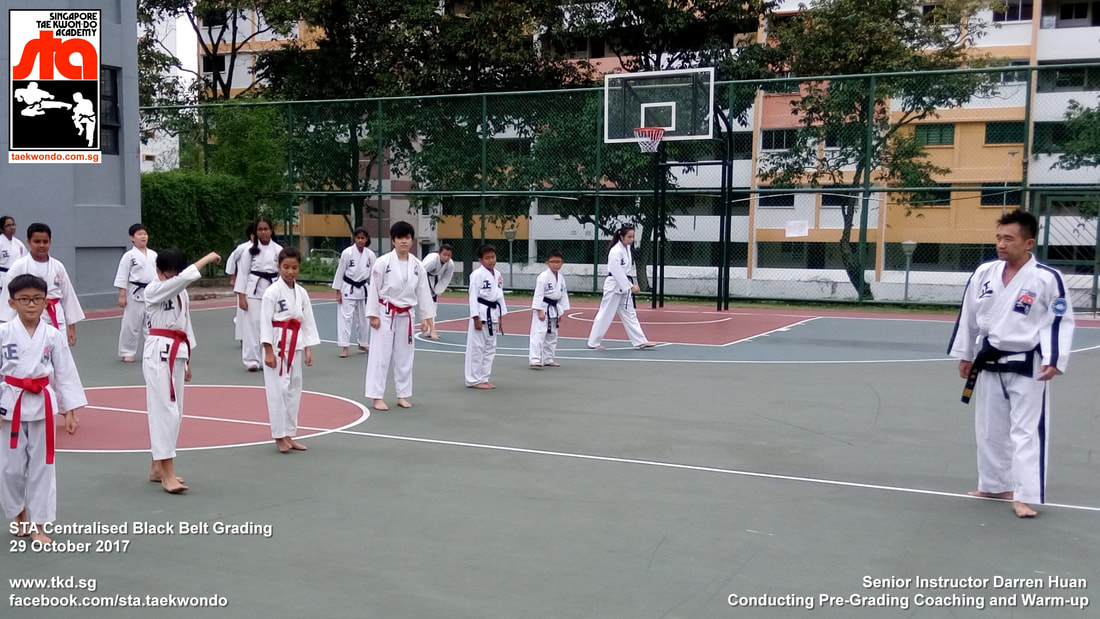 Senior Instructor Darren Huan Conducting Pre-Grading Coaching and Warm-up Centralised Black Belt Grading Singapore Taekwon-do Academy HQ STA Taekwondo International 29 Oct 2017