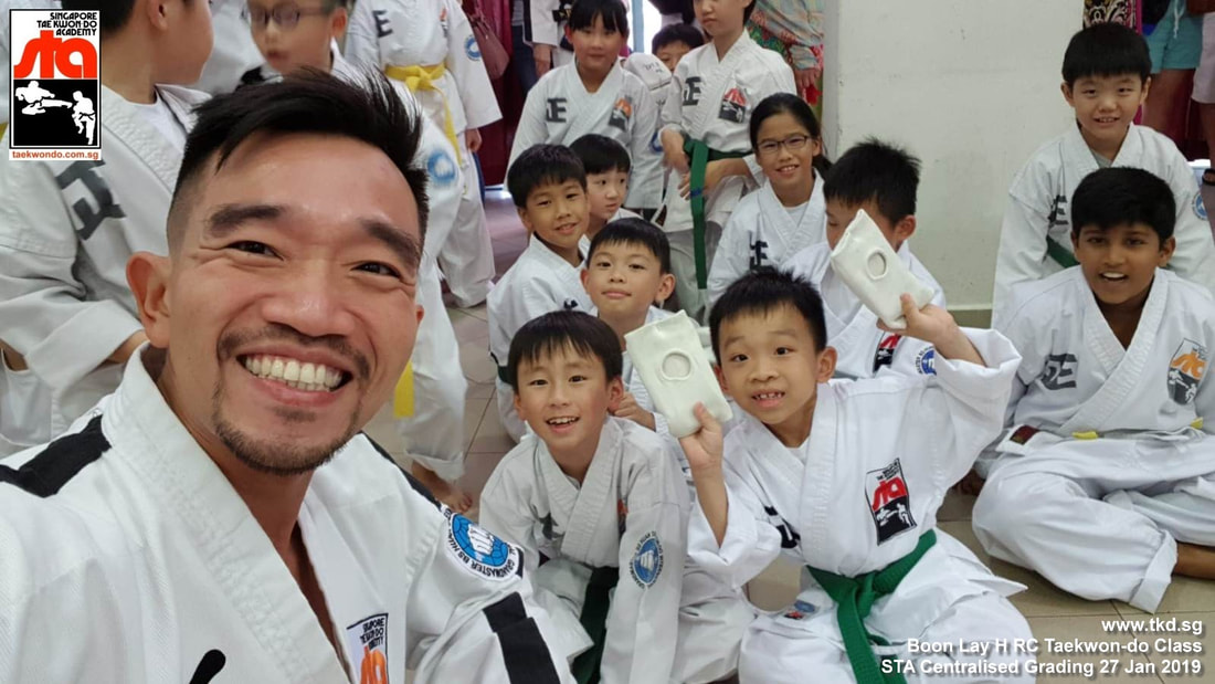 Grading 27 Jan 2019 Boon Lay H RC students Thaddeus n Skyler with Senior Instructor Darren Huan Singapore Taekwondo Academy